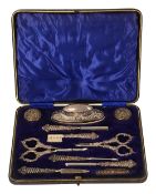 An Edwardian cased eleven piece silver mounted manicure set
