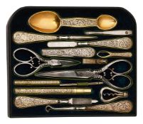 A mid Victorian fitted tray of mostly silver-gilt tools from a dressing box