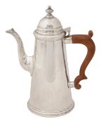 A modern silver coffee pot in early 18th century style