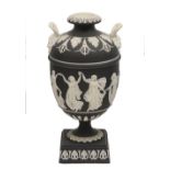 A 19th century black japserware twin handled urn