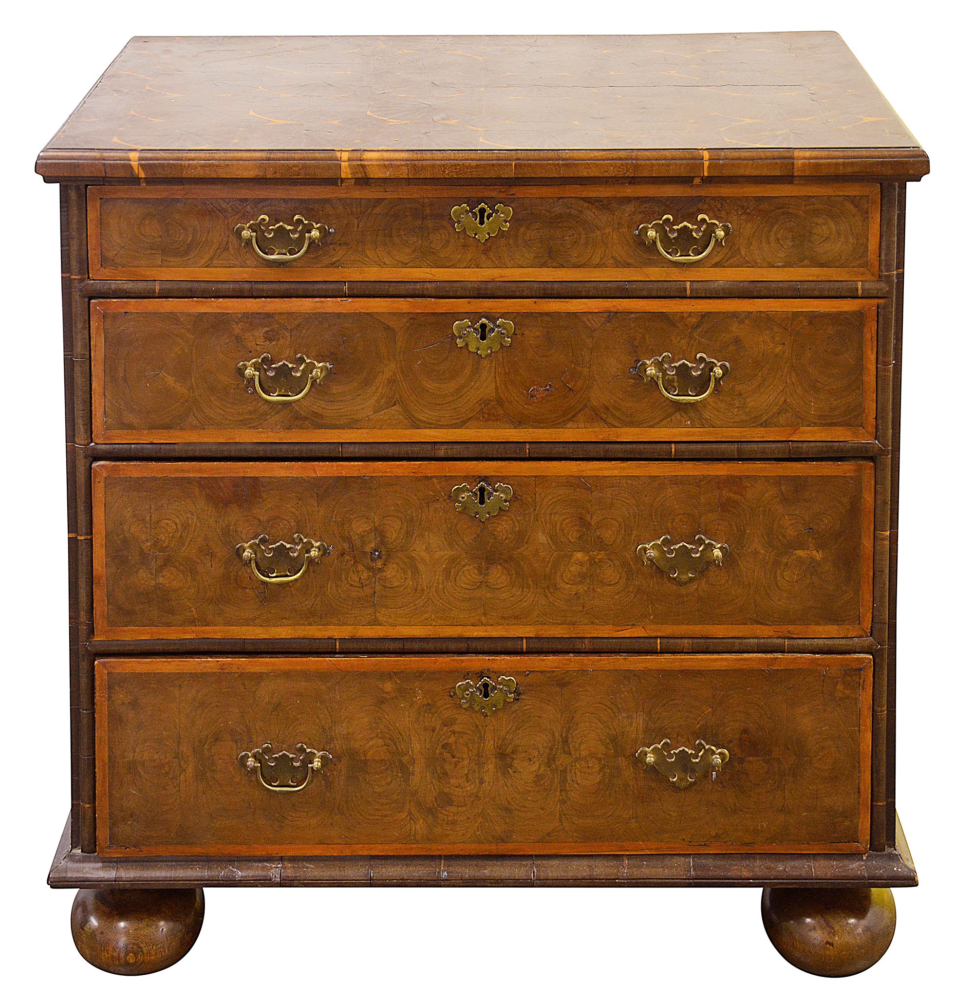 A William and Mary walnut oyster veneered chest of drawers