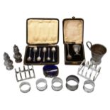 A collection silver to include cased sets, toast racks and other items