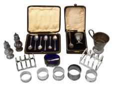A collection silver to include cased sets, toast racks and other items