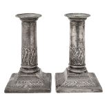 A pair of Edwardian silver dwarf column candlesticks