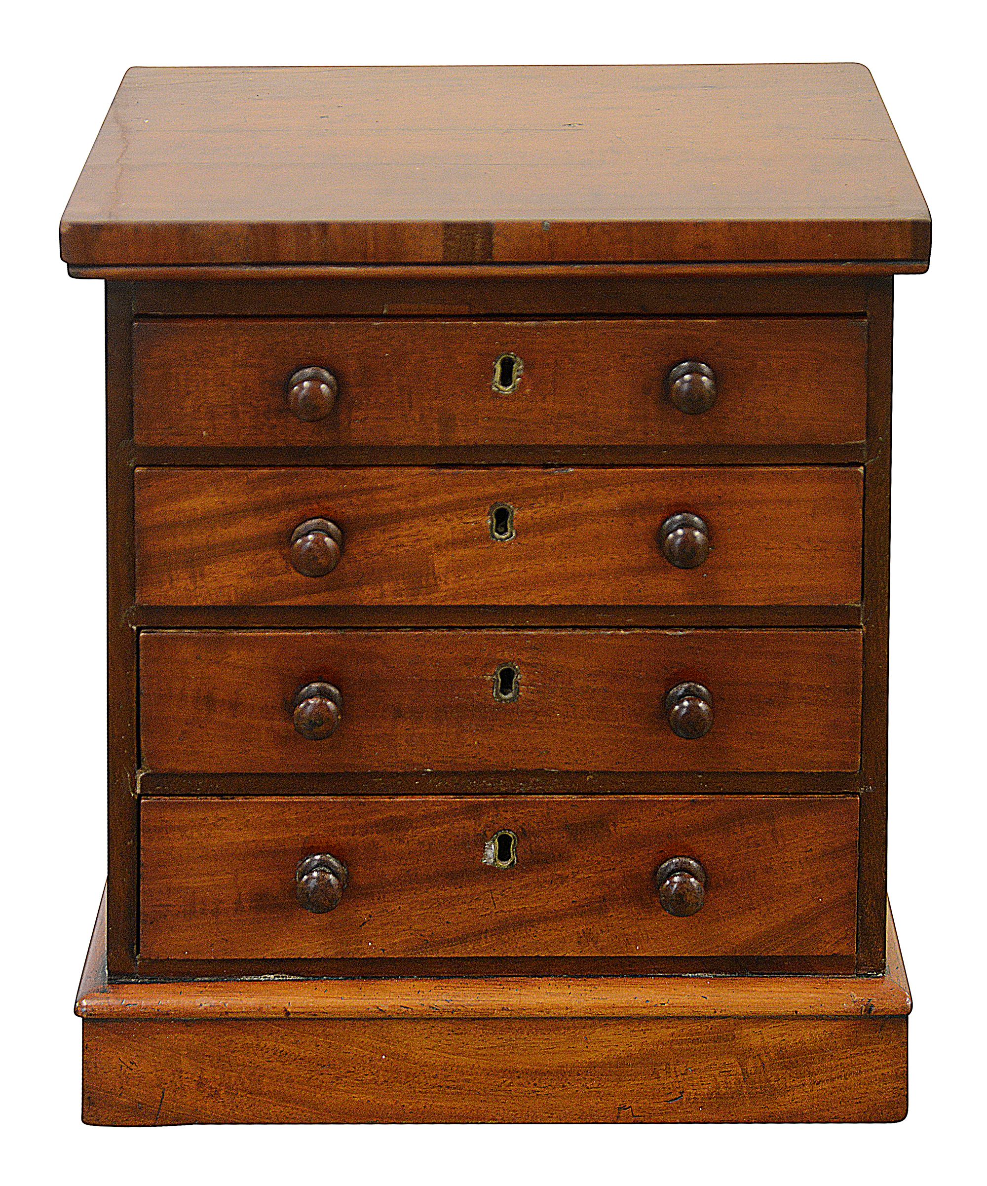 A Victorian miniature mahogany tabletop chest of drawers