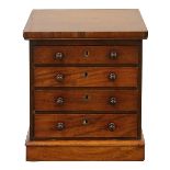 A Victorian miniature mahogany tabletop chest of drawers