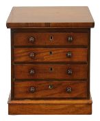 A Victorian miniature mahogany tabletop chest of drawers