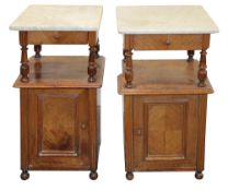 A pair of Louis Philippe walnut bedside cupboards