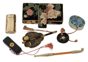 A late 19th Century Japanese embroidered purse (hakoseko) and other items