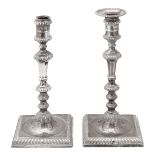 A pair of George II silver candlesticks
