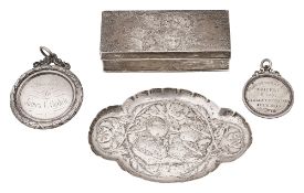 An Edwardian silver ring box, a pin dish and prize medals