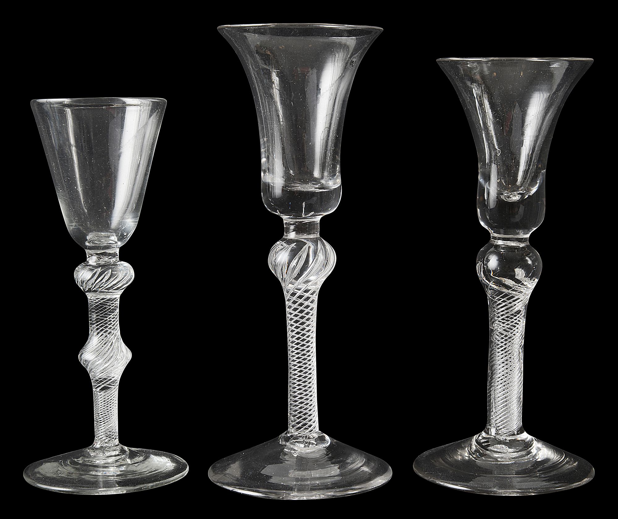 Three mid 18th century air twist wine glasses c.1750