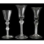 Three mid 18th century air twist wine glasses c.1750