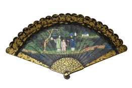 An early 19th century Chinese export gilt and black lacquer painted fan