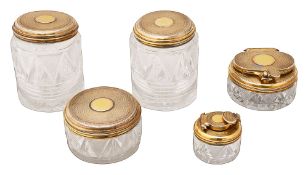 A George IV silver-gilt mounted travelling ink and four other toilet jars