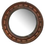 A mid 19th century oak convex mirror