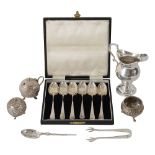 A late 19th century Indian Cutch silver three piece cruet set + other silver