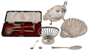 A late Victorian silver butter shell, a cream boat and assorted silver