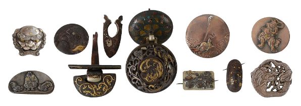 A collection of Japanese buttons, plaques and mounts