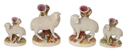 A pair of 19th century Staffordshire pottery sheep spill vases and two others
