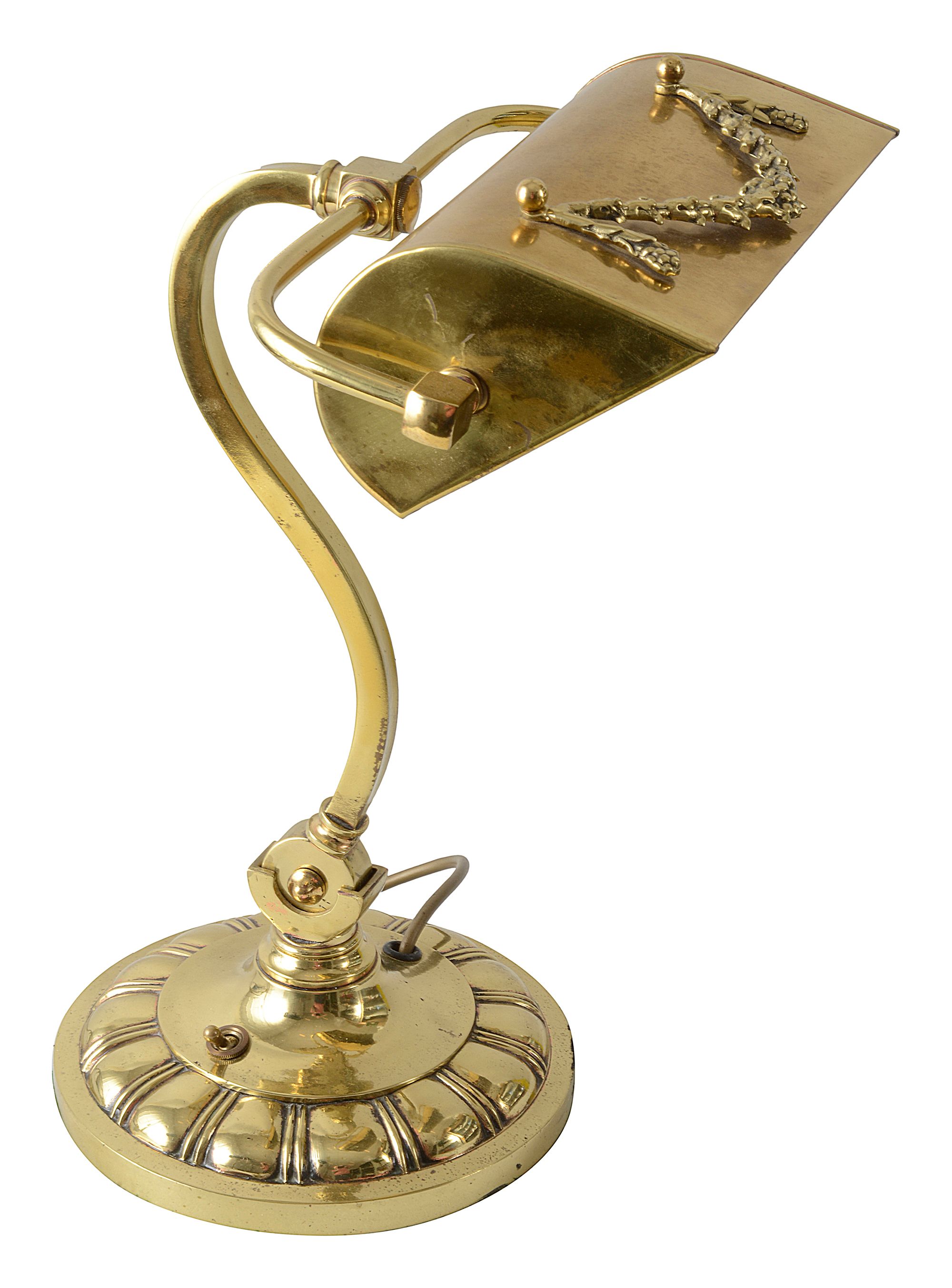 An Edwardian brass banker's lamp and Pullman lamp
