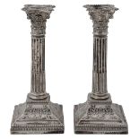 A pair of late Victorian silver Corinthian column candlesticks