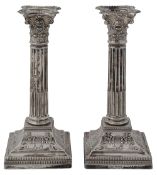 A pair of late Victorian silver Corinthian column candlesticks