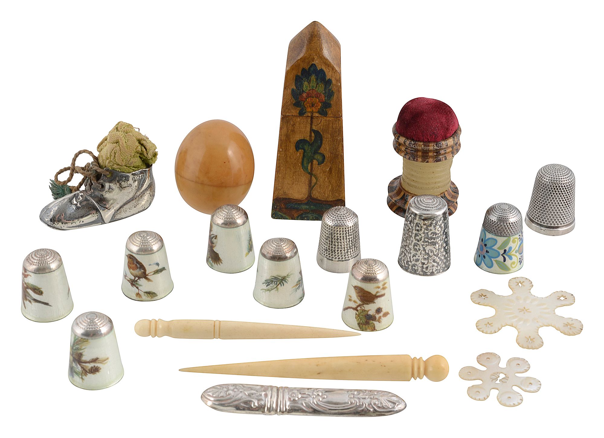 A collection of silver and other sewing items