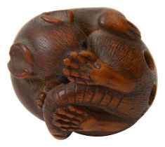 A 19th century Japanese Edo Period carved wood netsuke of a rat