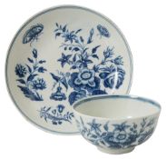 A Worcester blue and white 'Three Flowers' Pattern tea bowl and saucer