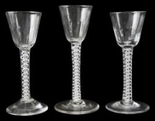 Three 18th century double series opaque twist wine glasses c.1765