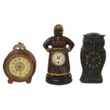 A carved wood novelty owl clock and two others.