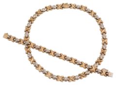 A 9ct gold bi-coloured fancy link necklace with matching bracelet