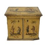 A Regency cream lacquered and gilt chinoiserie table top sewing cabinet