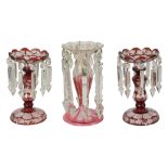A pair of Bohemian flash-cut ruby table lustres, and another