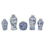 Four Chinese blue and white vases and a ginger jar