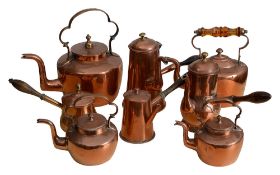 Three late Georgian century copper coffee pots, a brandy pan and kettles