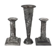 A pair of late Victorian silver dwarf candlesticks and a spill vase
