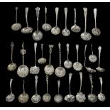 A collection of late Victorian and Edwardian silver sifter spoons