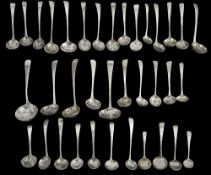 A collection of George III Old English pattern silver sifter spoons