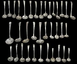 A collection of George III Old English pattern silver sifter spoons
