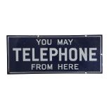 A blue and white enamel telephone sign