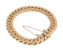 An 18ct gold flattened curb link bracelet