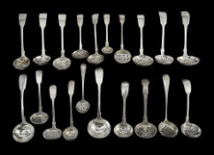 A collection of mostly early to mid Victorian silver fiddle pattern sifter spoons