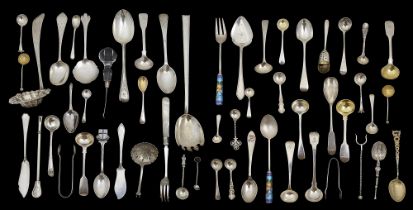 A collection of silver spoons and serving utensils