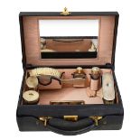 A George VI leather dressing case with silver fittings