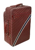 A red trolley rolling suitcase by Goyard