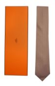 A pale blue and orange Hermes silk tie