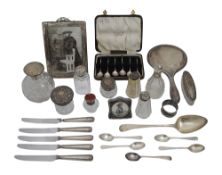 A collection of silver to include a hand mirror and scent bottles