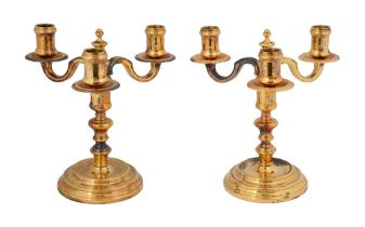 A pair of French Christofle gilt three light candelabra